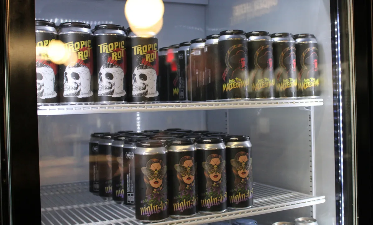Ceremony Brewing bottle shop fridge stocked with their own canned beers including Tropic Rot and Nightshade